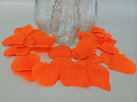 Vibrant orange silk rose petals (864 count) perfect for weddings, events, and crafts, now at a clearance price.