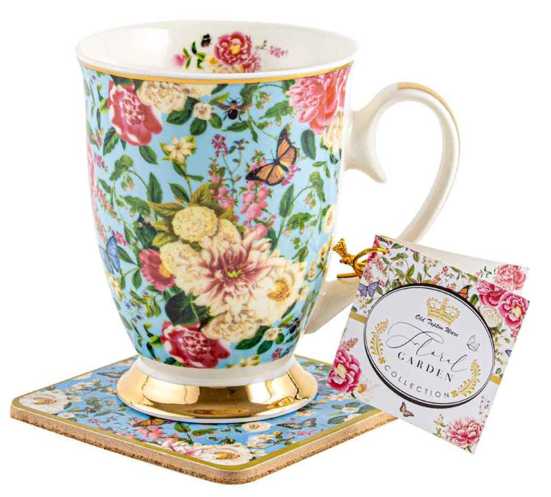 Mug and coaster set in powder blue with vibrant floral design, ideal for tea or coffee. Stylish and functional home accessory.