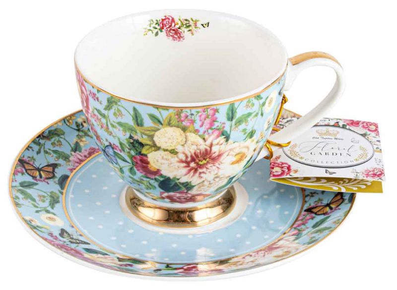 Delicate powder blue teacup and saucer set featuring a whimsical floral design, perfect for elegant tea moments.