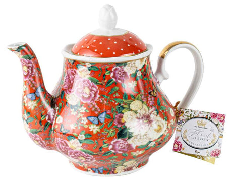 Elegant red ceramic teapot with a vibrant floral design, perfect for serving and enjoying tea in style.