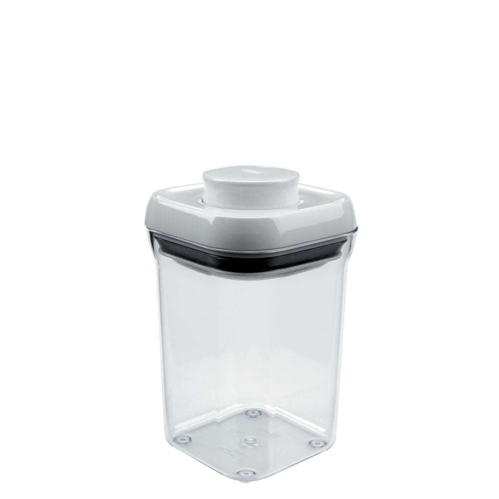 A clear OXO POP Container Small Square, 0.9 quart with a push-button airtight seal for organized dry food storage.