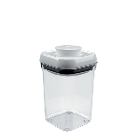 A clear OXO POP Container Small Square, 0.9 quart with a push-button airtight seal for organized dry food storage.