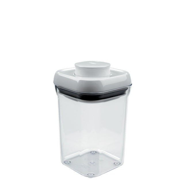 A clear OXO POP Container Small Square, 0.9 quart with a push-button airtight seal for organized dry food storage.