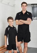 Mens Splice Polo in black and orange, featuring breathable polyester, short sleeves, and a pocket, size 3XL.