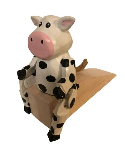 Wooden cow-shaped door wedge, measuring 15 x 11 x 6 cm, adds charm and functionality to any room decor.