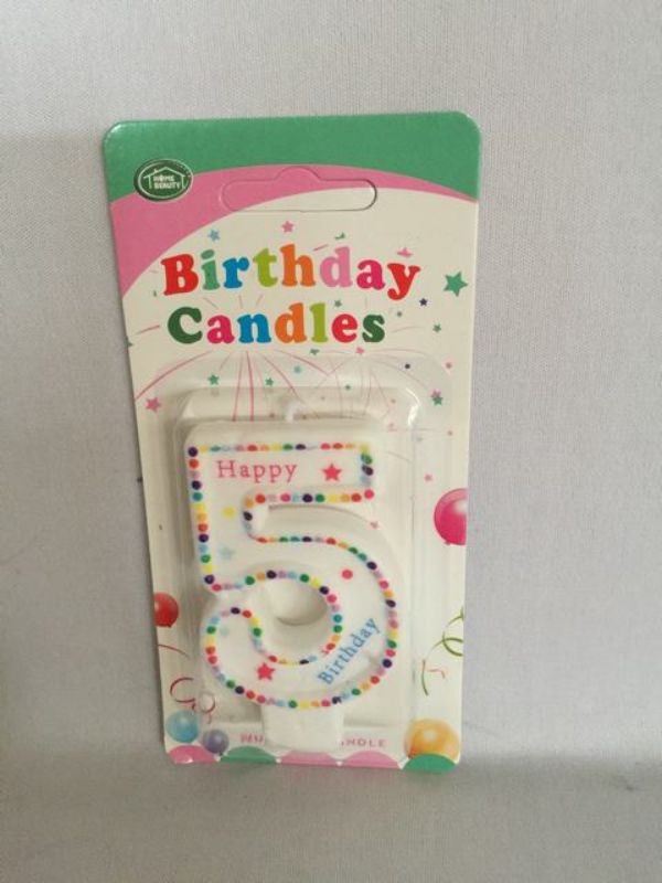 Vibrant set of 12 Birthday Candles in multiple colors, perfect for adding fun to cakes at any celebration.