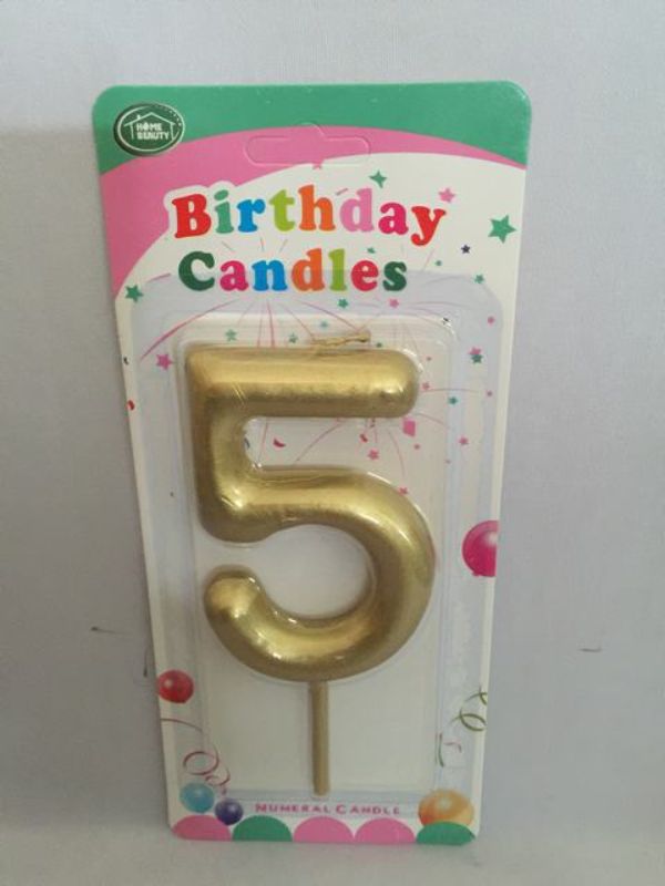 Elegant set of 12 gold birthday candles in varying heights, perfect for adding a luxurious touch to any celebration.