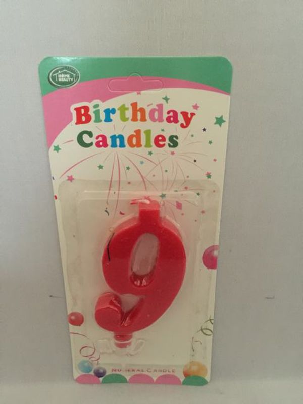 Bright red birthday candles, set of 12, perfect for cakes and celebrations, featuring a clean burn and classic design.
