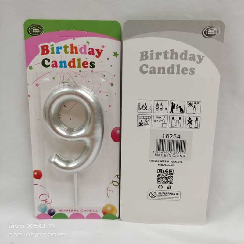 Set of 12 elegant silver birthday candles, 9 cm long, perfect for cakes, creating a magical and stylish celebration atmosphere.
