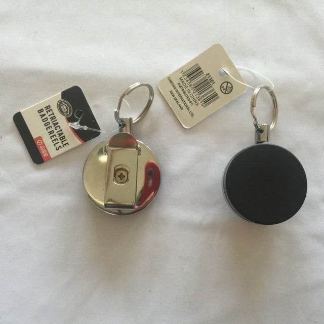 Retractable badge reels in a pack of 12, designed for secure and stylish ID display with smooth retraction.