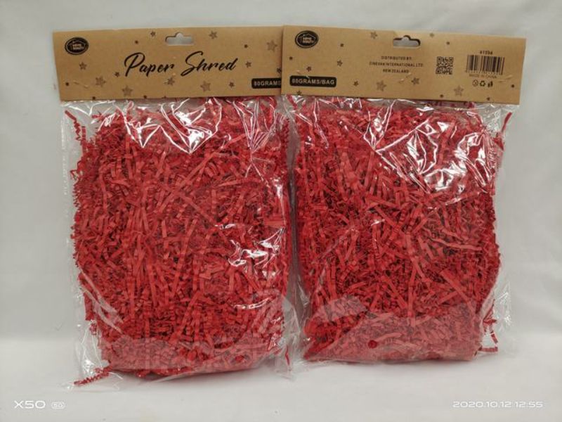 Bright red paper shred in 80g packs, perfect for enhancing gift baskets and event decor with vibrant, eco-friendly cushioning.