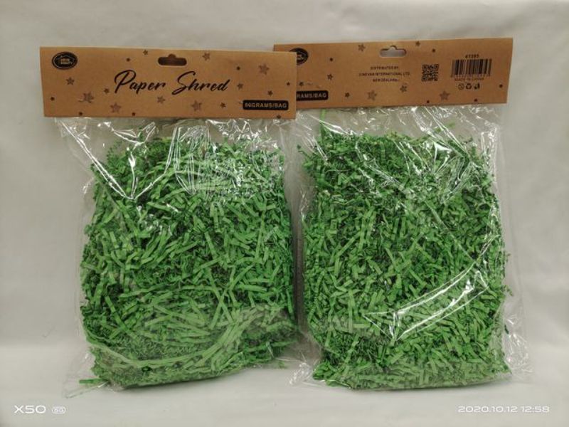Vibrant green 80g paper shred in a pack of 12, perfect for crafts, gifts, and eco-friendly decorations.