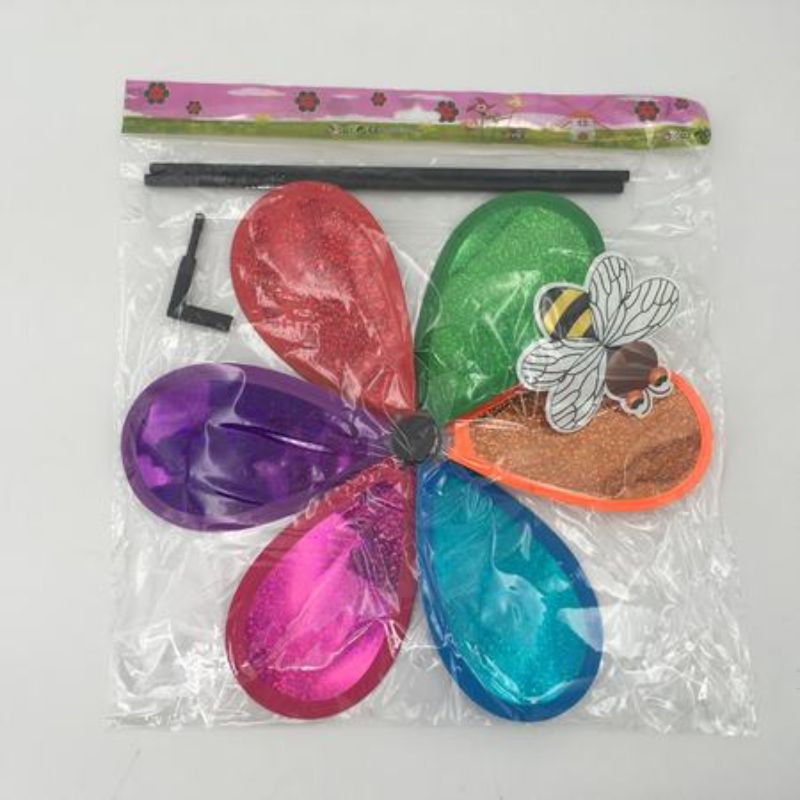 Colorful set of 12 windmills spinning in the breeze, perfect for outdoor decor and festive celebrations.