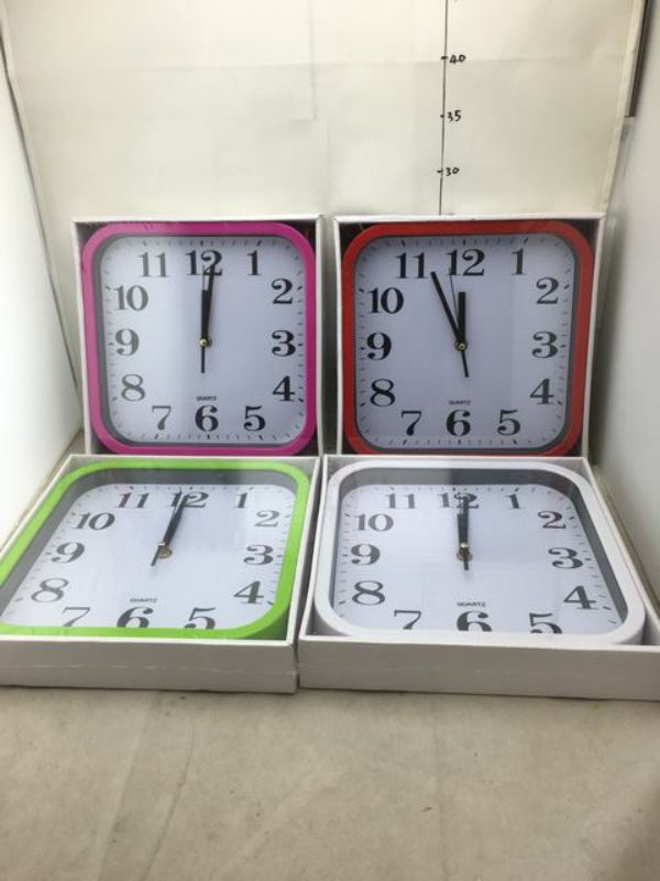Set of 6 assorted wall clocks featuring unique designs for stylish home or office decor.