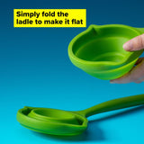 Green silicone foldable ladle with heat resistance, dual pouring spouts, and a space-saving design for easy kitchen use.