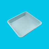 Light blue Tasty Brownie Pan with non-stick coating for easy release, ideal for baking fudgy brownies and desserts up to 230°C.