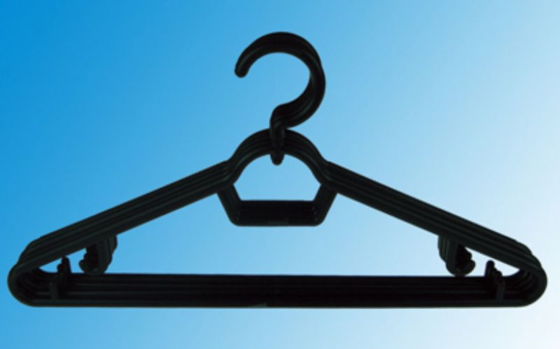 Set of 24 durable black plastic clothes hangers, 41.7cm wide, ideal for organizing shirts and jackets without creasing.