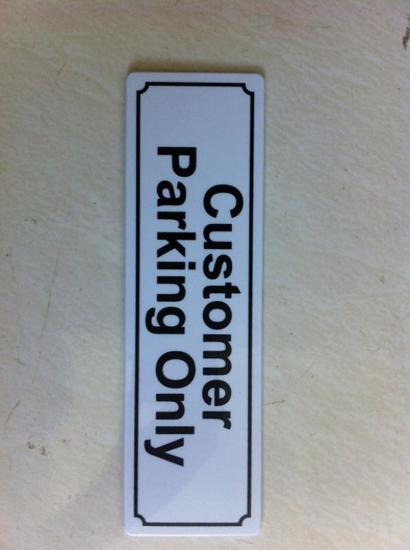 Set of 12 durable 'Customer Parking Only' signs, measuring 20cm x 6cm, ideal for managing business parking efficiently.