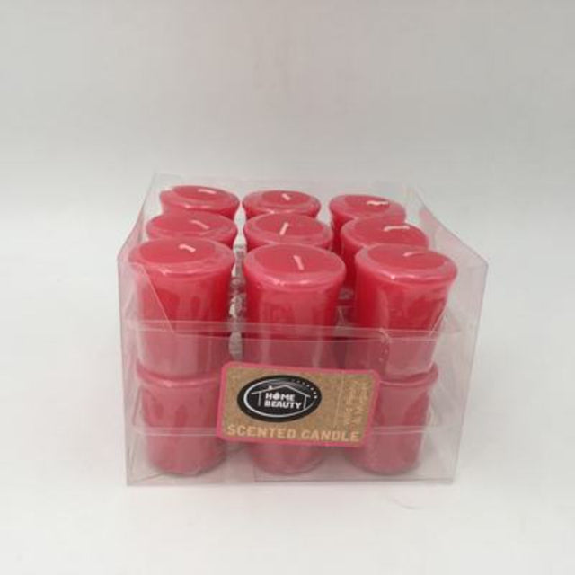 Set of 18 hot pink votive candles with wild peony and muguet fragrance, ideal for creating a warm ambiance.