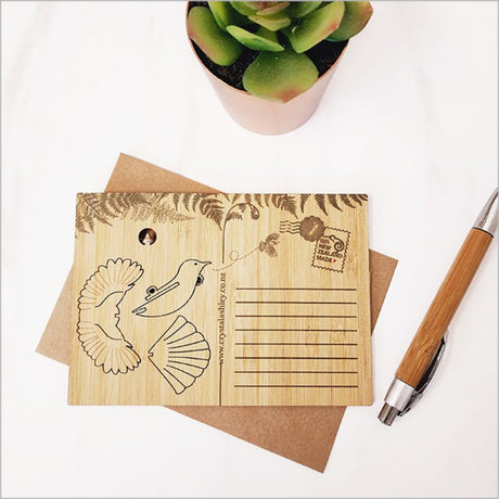 Bamboo postcard featuring a Tui design, transforming into a 3D ornament, ideal for eco-friendly gifting and home decor.