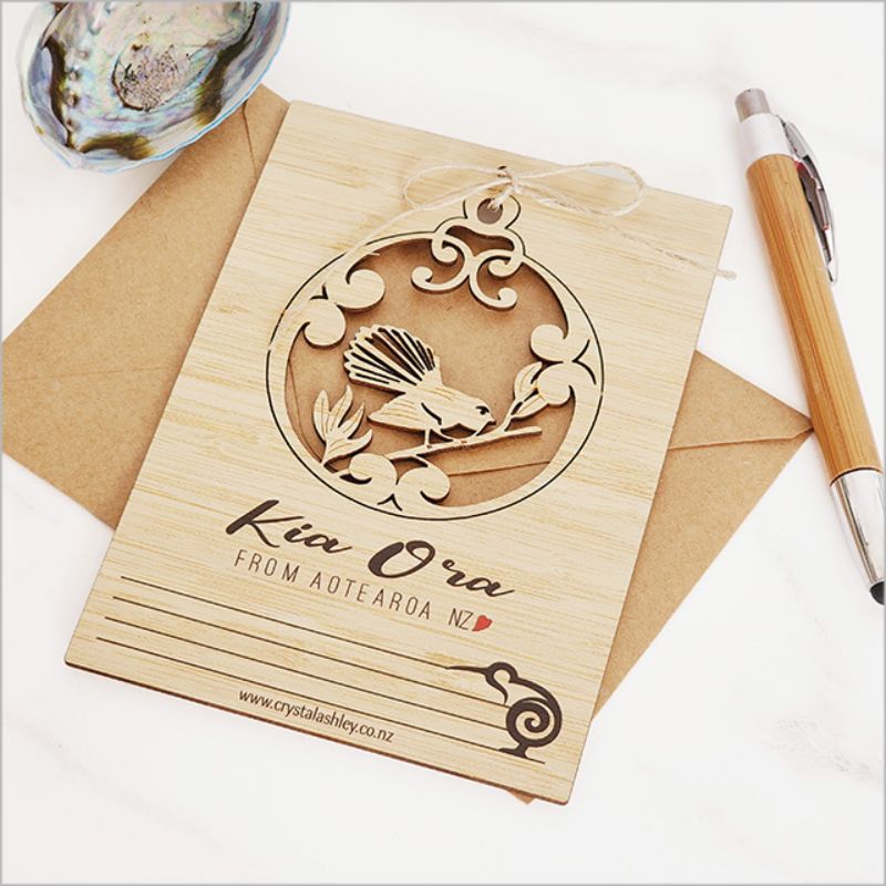 Bamboo postcard featuring a Kia Ora Fantail design, eco-friendly, and perfect for greetings or decorative use.