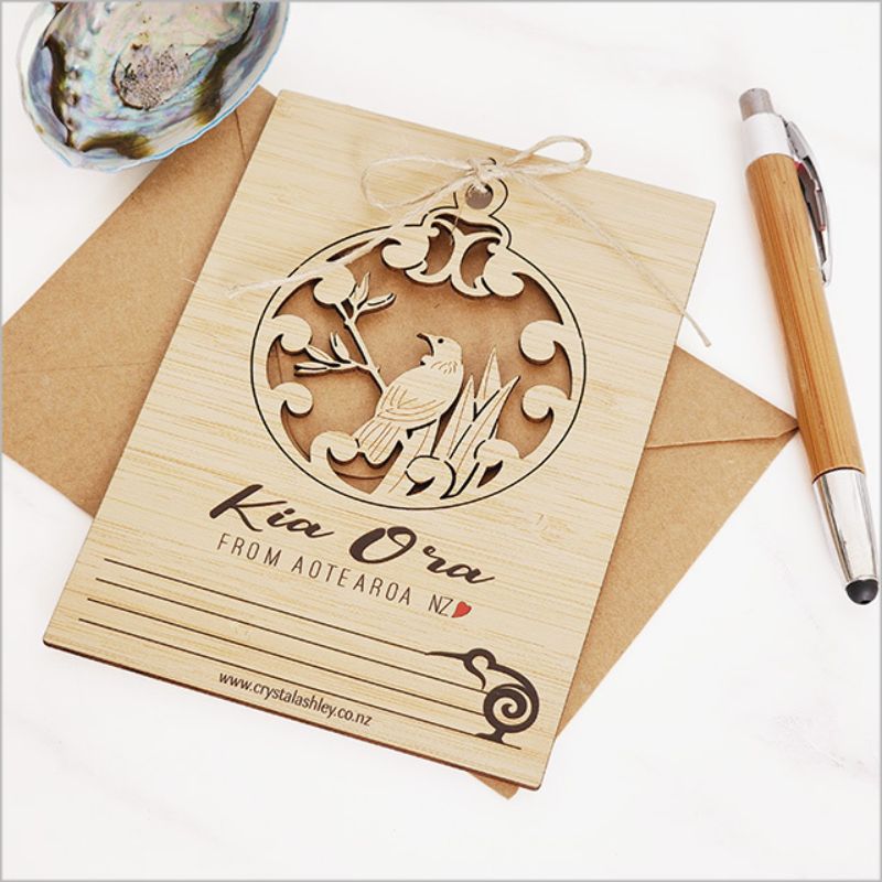 Eco-friendly bamboo postcard featuring vibrant Kia Ora Tui design, perfect for bird lovers and heartfelt messages.