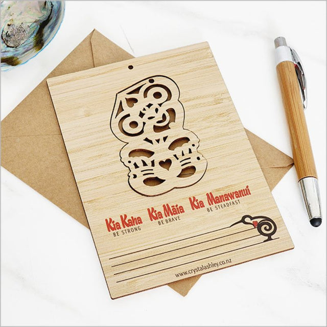 Eco-friendly bamboo postcard featuring vibrant Tiki design, ideal for messages and as charming decorations.