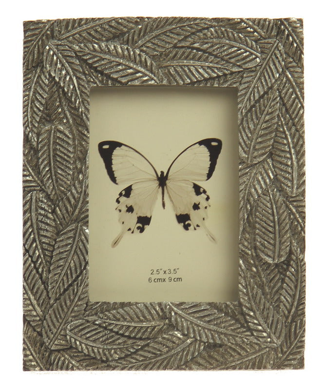 Elegant champagne photo frame with fern leaf design, perfect for 2.5x3.5 inch photos, enhancing any decor.