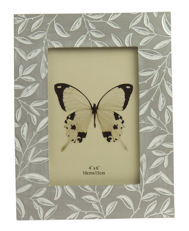 Elegant etched wooden photo frame with small leaf design, fits 4 x 6 inch photos, perfect for showcasing cherished memories.