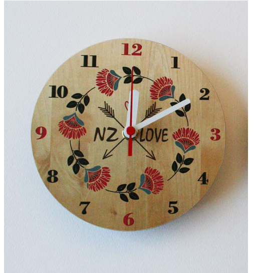 Vibrant Pohutukawa NZ Clock made of printed MDF, featuring a round design and striking red flower print, perfect for any indoor space.