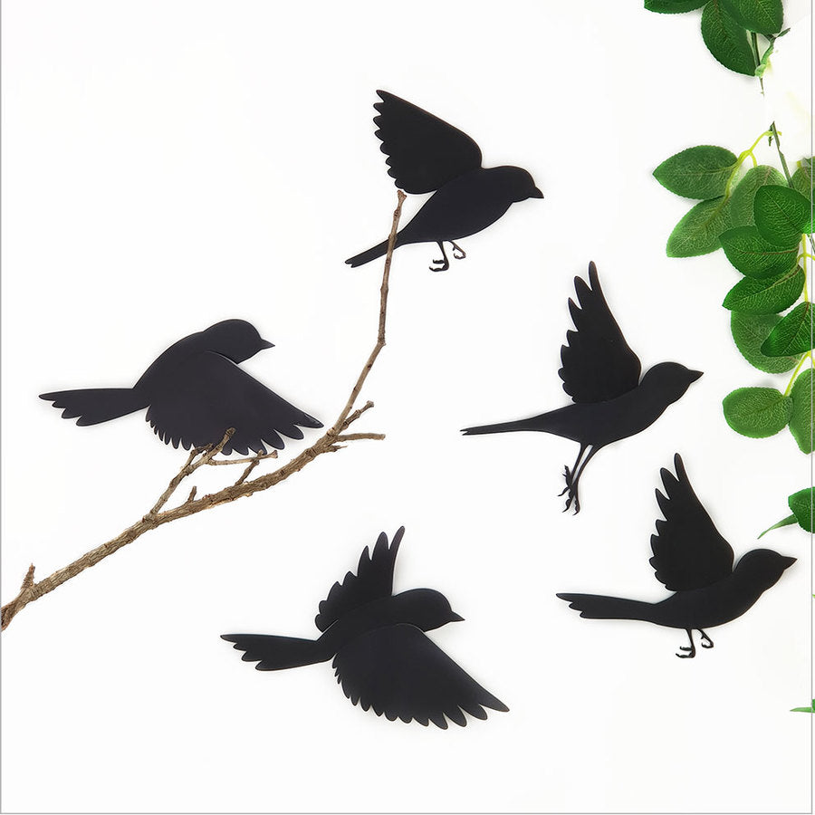 Wall art featuring five black polypropylene sparrows in flight, perfect for customizable home decor.