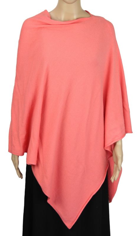 Vibrant watermelon stretch poncho, soft fabric blend for stylish layering, perfect for casual or chic outfits.
