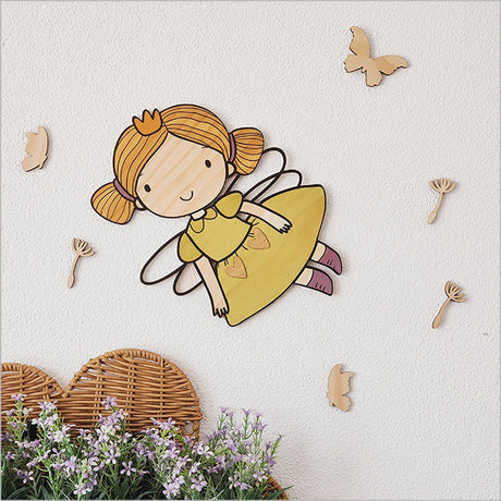 Pine Wall Art featuring a whimsical fairy, butterflies, and dandelions, crafted from eco-friendly pine veneer.