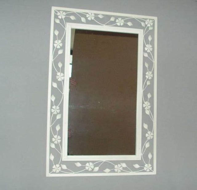 Cream rectangular mirror (75cm x 50cm) enhancing space and light, perfect for any room’s decor.