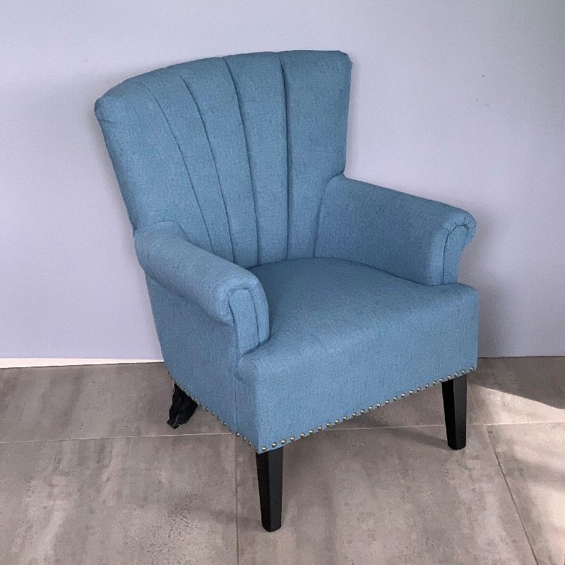 Stylish blue armchair with plush cushioning, perfect for modern living spaces, measuring 71D x 70W x 86H cm.