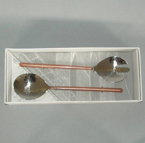 Elegant salad server with copper handles, designed for stylish tossing and serving of fresh salads and pasta dishes.