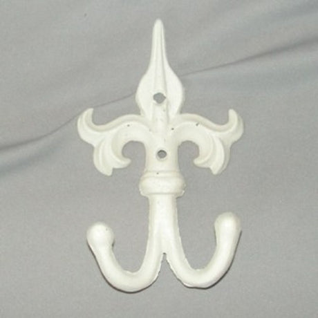 Antique cream cast iron double hook with Fleur De Lie motif, ideal for stylish home organization and decor.