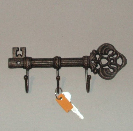 Elegant solid cast iron key hook measuring 23 x 11 inches, perfect for organization and adding vintage charm to your home.