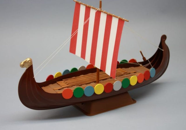 Detailed wooden Viking ship model kit with laser-cut parts and paper sails, perfect for novice and experienced builders.