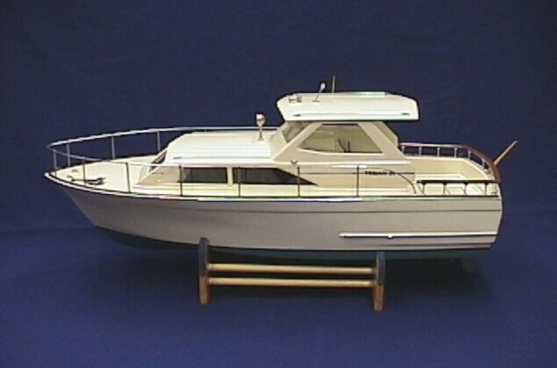 Detailed 31" wooden model kit of the Trojan Cabin Cruiser, perfect for R/C or display, featuring die-cut plywood and metal parts.