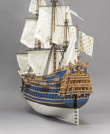 Detailed wooden model of the King Louis XIV Warship Soleil Royal, showcasing ornate craftsmanship and historical accuracy.