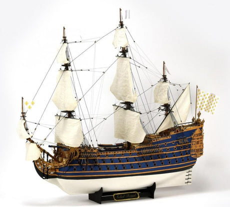 Detailed wooden model of King Louis XIV's warship Soleil Royal, showcasing intricate craftsmanship and historical accuracy.