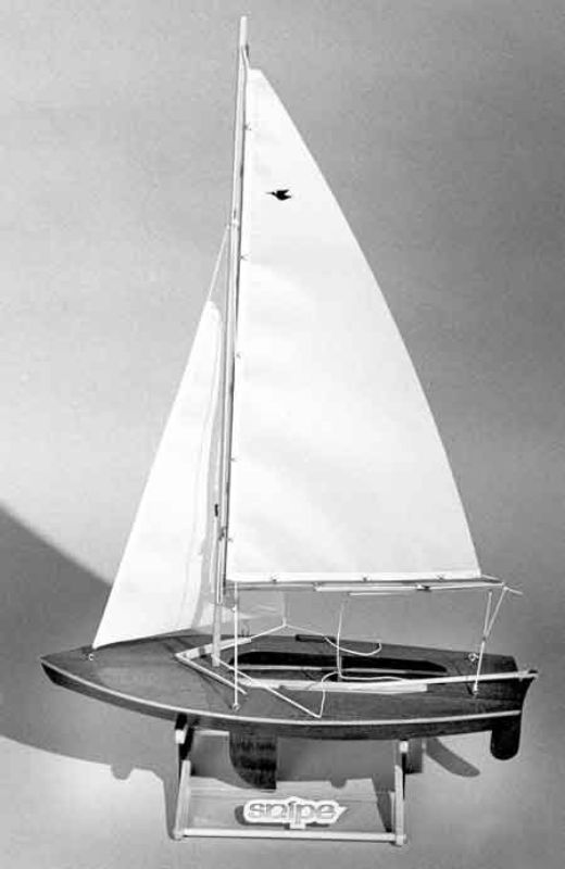 Wooden 16" Snipe Sailboat model kit featuring rich mahogany decking, complete with sails and rigging for static display.