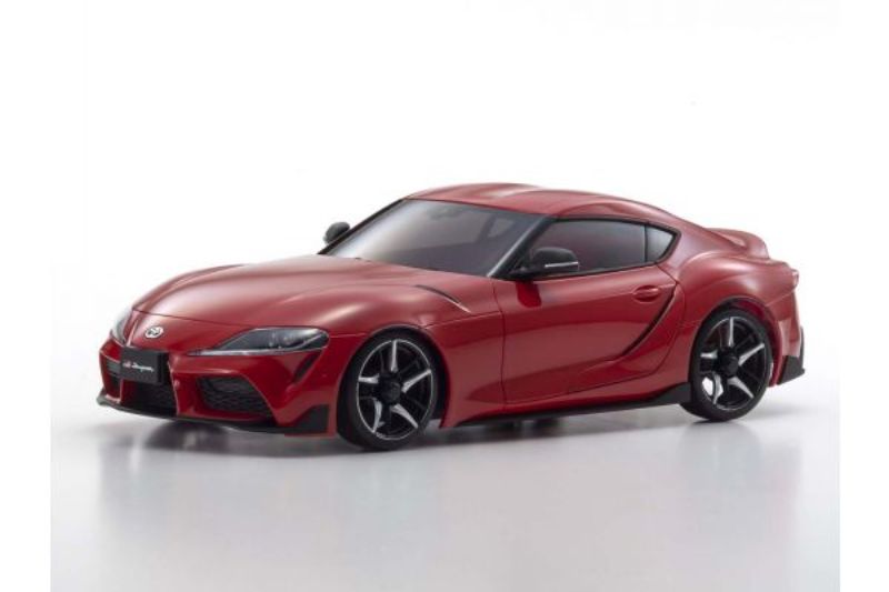 Kyosho AWD GR Supra body set in Prominence Red, featuring high-detail shell, precision wheels, and protective display case.