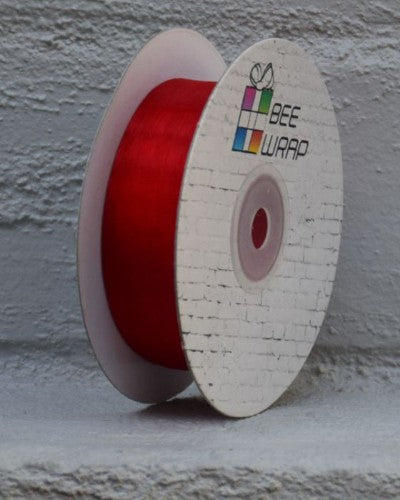 Red cut edge organza ribbon, 25mm wide and 50m long, perfect for elegant gift wrapping and crafting projects.