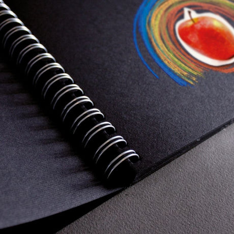 Fabriano Black Book with 40 thick black pages for vibrant sketching, measuring 30 x 30 cm, ideal for artists on the go.