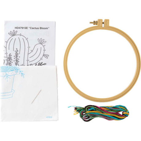 Bright embroidery kit featuring a blooming cactus, includes fabric, hoop, floss, needle, and instructions for easy crafting.