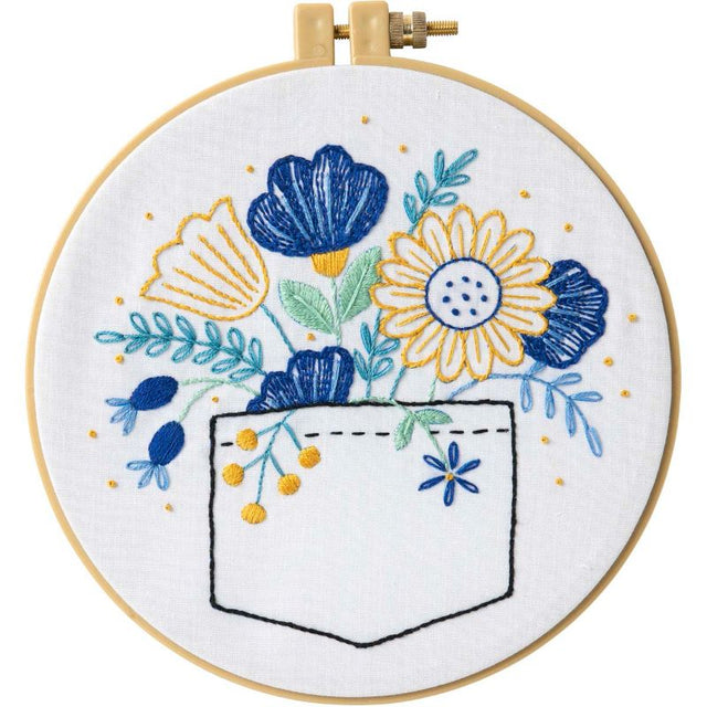 Bucilla Pocket Full of Posies embroidery kit featuring floral design, includes fabric, hoop, floss, needle, and instructions.