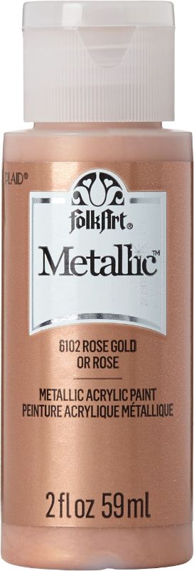 Folk Art Rose Gold Acrylic Metallic Paint in 2oz bottle, perfect for adding a shiny finish to various DIY projects.