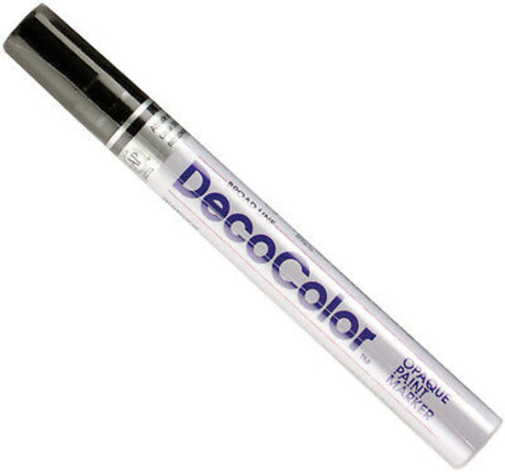 Marvy Decocolor Black paint marker with broad tip for vibrant designs on diverse surfaces like glass, wood, and metal.